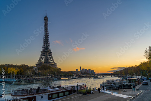Blue Hour in Paris With Tourists Cruises on the Seine River and Eiffel Tower