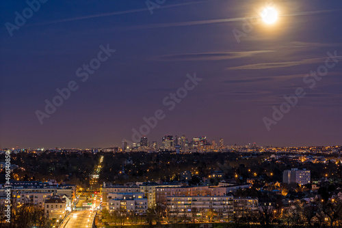 Blue and Purple Sky Over La Defense District at Night With Full Moon