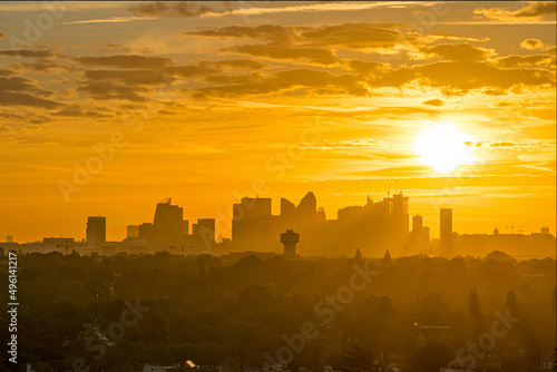 Silhouette Towers Skyline of La Defense District at Sunrise With Yellow Sky