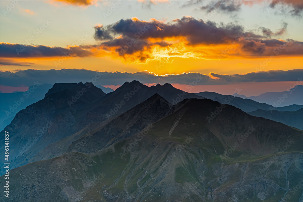 Orange Sky at Sunset With Cloudy Sky Over French Alps Mountains Peaks