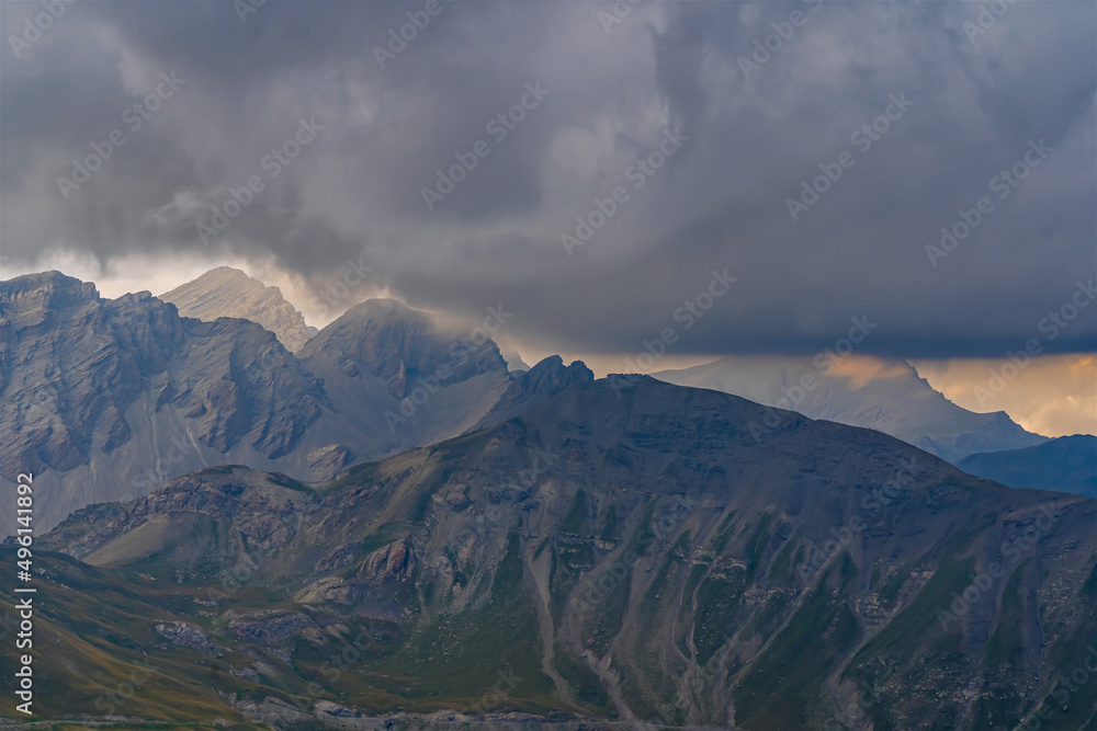 Powerful and Stormy Clouds Moving Over French Alps Mountains Peaks at Day