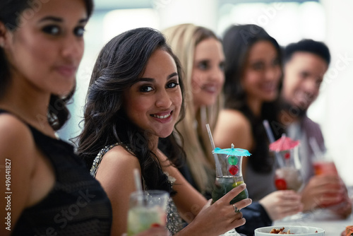 Girls just want to have fun. Portrait of a group of girlfriends enjoying cocktails together on a night out.