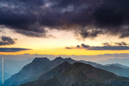 Golden Hour With Cloudy and Purple Sky Over French Alps Mountains Peaks