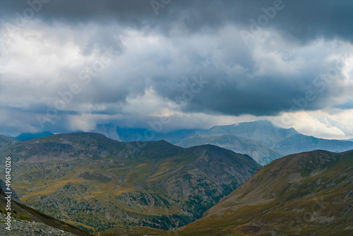 Cloudy and Stormy Sky Over French Alps Mountains With Grass