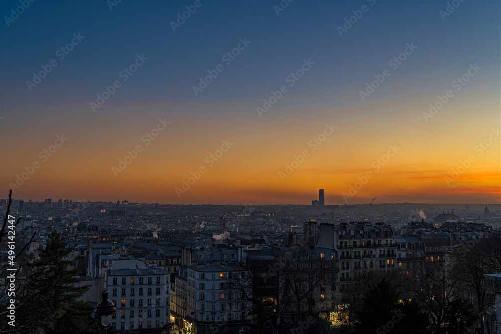 Golden Hour and Orange Sky Over Paris Rooftops at Sunset From Montmartre Hill