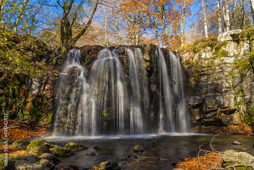 Waterfall in a Beautiful Place With Fall Color Rocky Ground Lights and Shadows