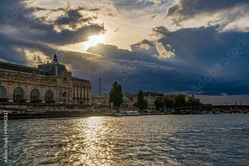 Sunlight Reflections on Seine River in Paris With Eiffel Tower and Stormy Clouds