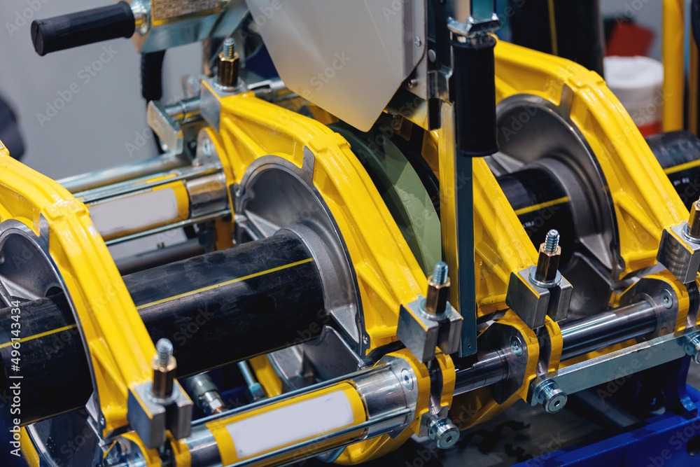 Fototapeta premium Automatic hydraulic pipe welding for connecting PE or HDPE