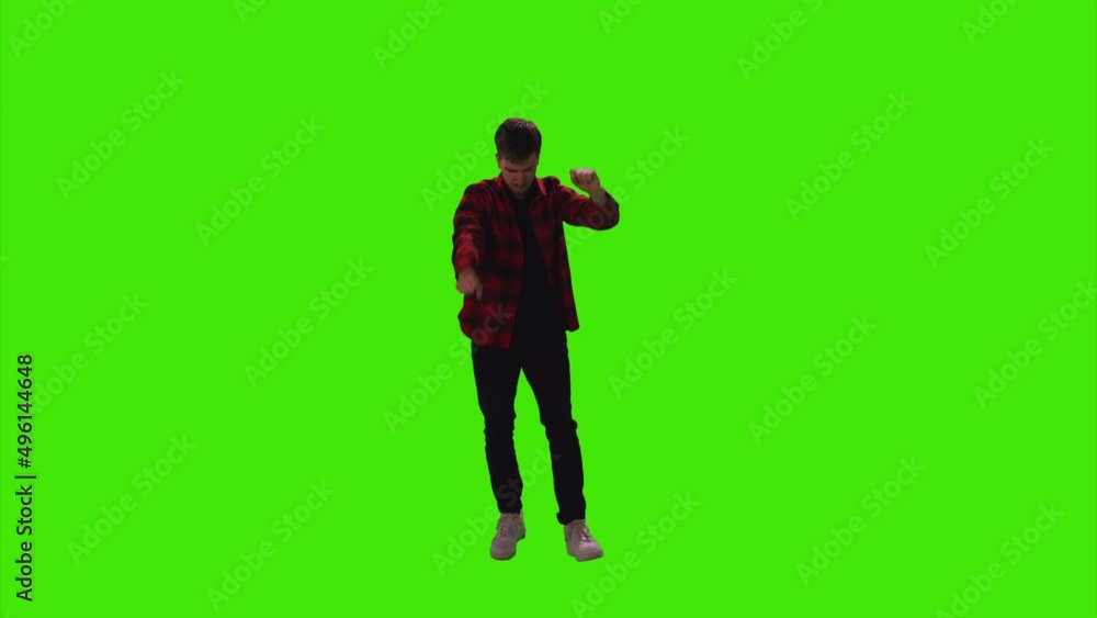 A successful man dancing in front of a disco light effect on greenscreen