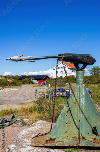 Old harpoon gun with harpoon used for whaling, on public display in the village of Langegarde, South Koster Island, Sweden. photo