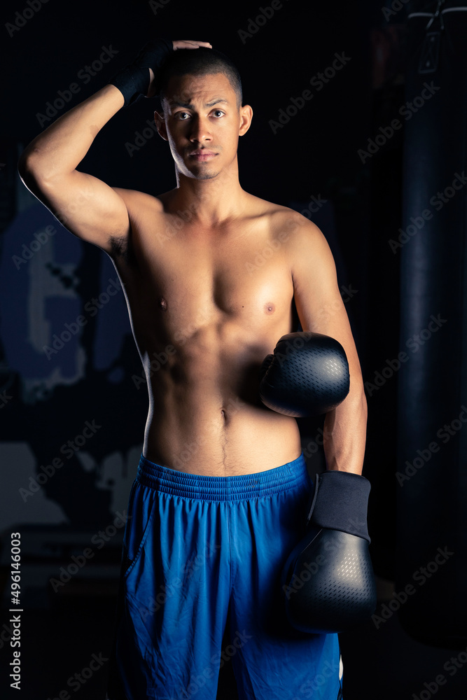 Hispanic male boxer touching head Hispanic male boxer touching head