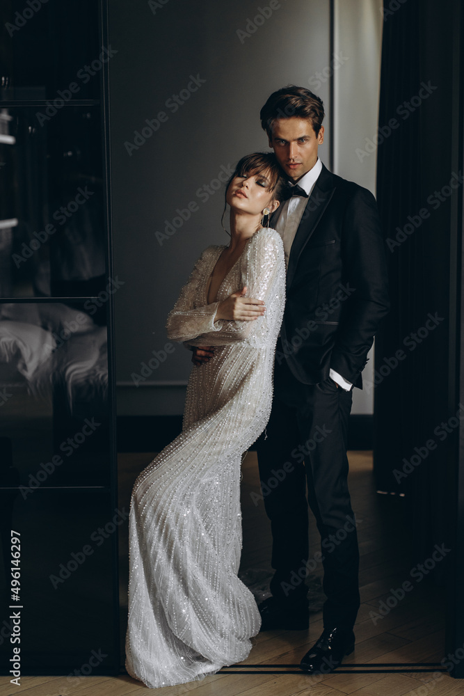 Beautiful and sexy bride and groom in a luxury hotel. Wedding day