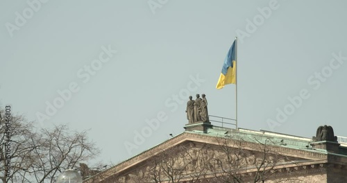 Flag of Ukraine on top of the Alte Nationalgalerie on the Museumsinsel in Berlin photo