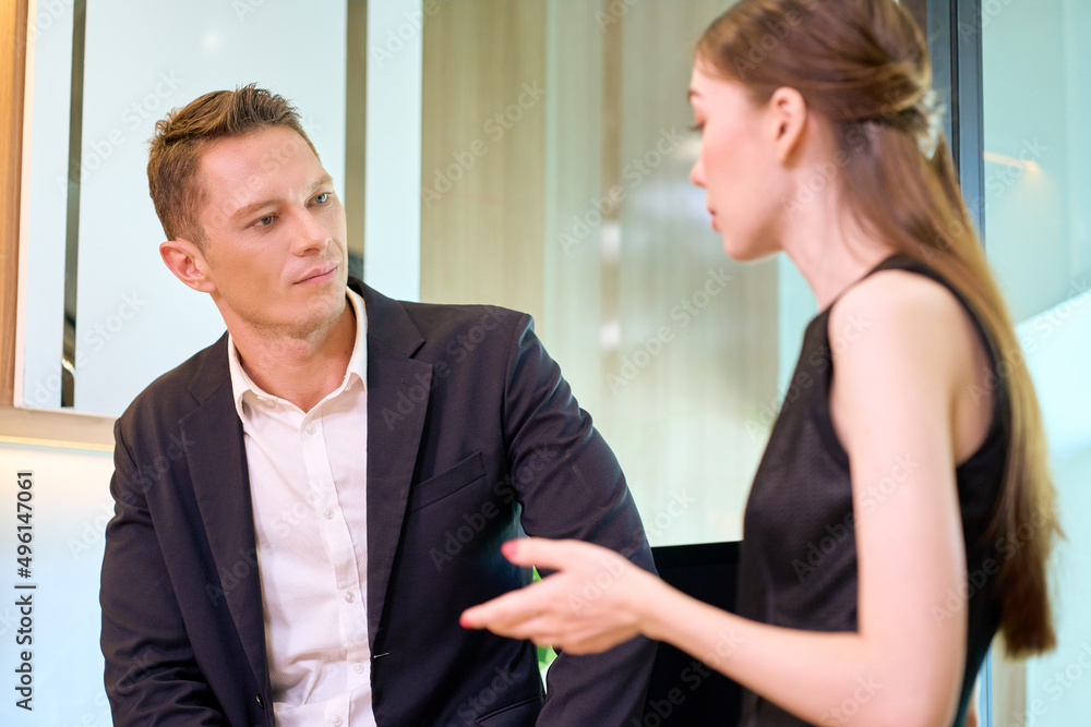 Businessman and woman are talking for working in office to planning strategic business success Businessman and woman are talking for working in office to planning strategic business success