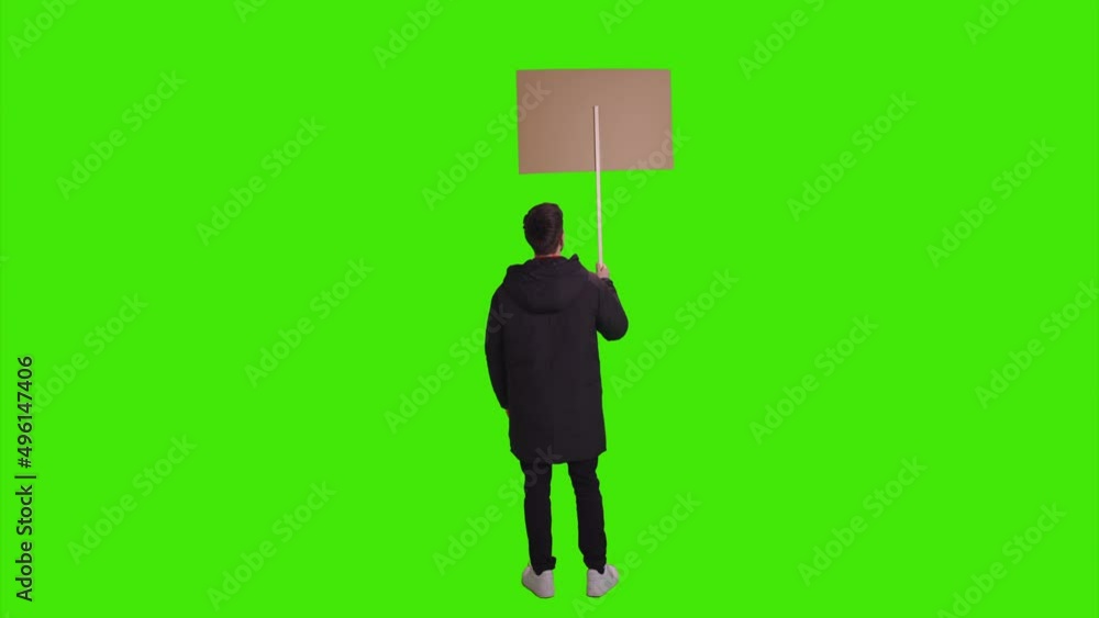 A man standing with a banner for protest and looking around everything on greenscreen A man standing with a banner for protest and looking around everything on greenscreen