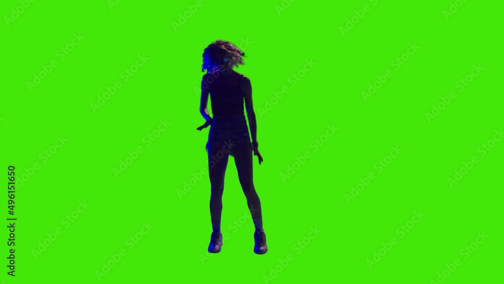 A positive girl is dancing in front of crowd in slow-motion on greenscreen A positive girl is dancing in front of crowd in slow-motion on greenscreen