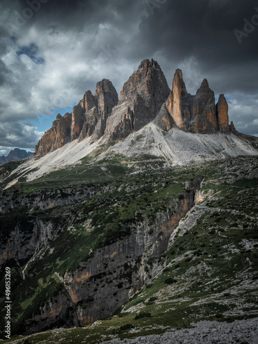 Mountain panorama with Three Peaks mountain summits in the Dolomite Alps in South Tyrol with clouds in sky.