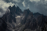 Mountain peaks in the Dolomite Alps in South Tyrol with dramatic cloudy sky, Three Peaks Nature Reserve, Italy.
