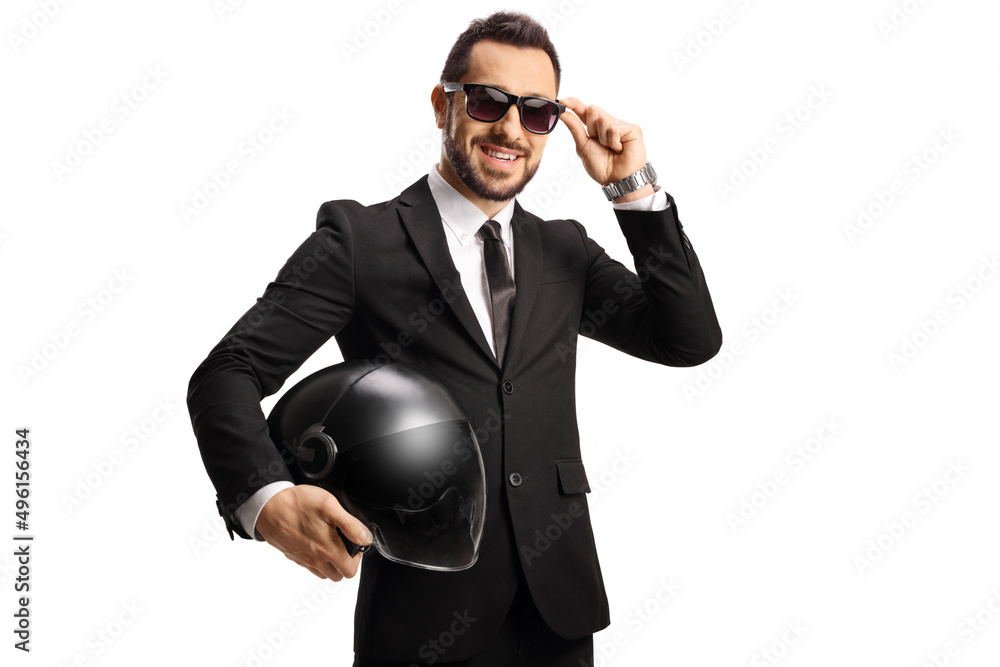 Young businessman holding a helmet and wearing sunglasses Young businessman holding a helmet and wearing sunglasses