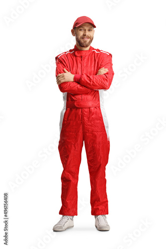 Racer with a helmet and a red suit posing with crossed arms
