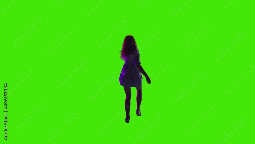A beautiful brown hair girl dancing in disco with her hands raised on greenscreen A beautiful brown hair girl dancing in disco with her hands raised on greenscreen