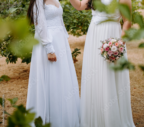 Lesbian brides holding wedding bouquets