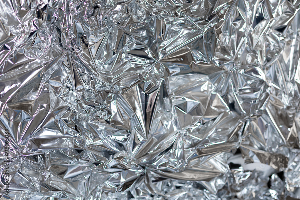 Silver foil with shiny surface for background Silver foil with shiny surface for background