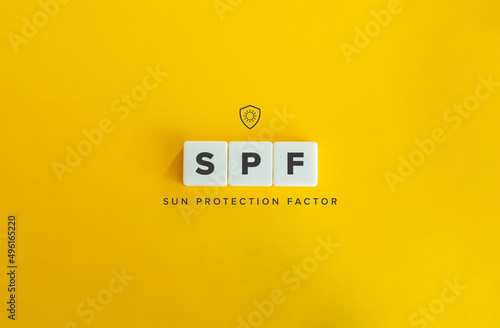 SPF  Sun Protection Factor  Banner. Letter Tiles on Yellow Background. Minimal Aesthetics.