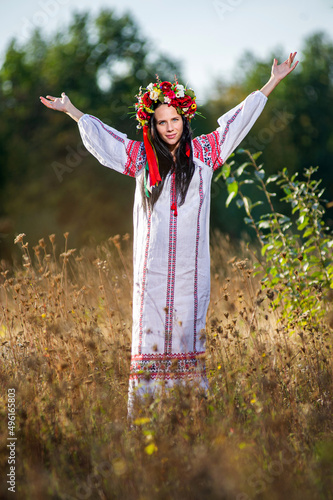 Outdoor portrait of beautiful pregnant Ukrainian woman