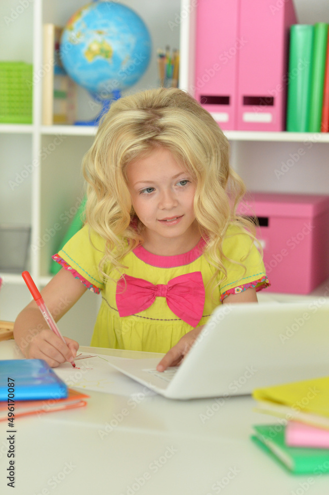 Beautiful girl using laptop at desk at home Beautiful girl using laptop at desk at home