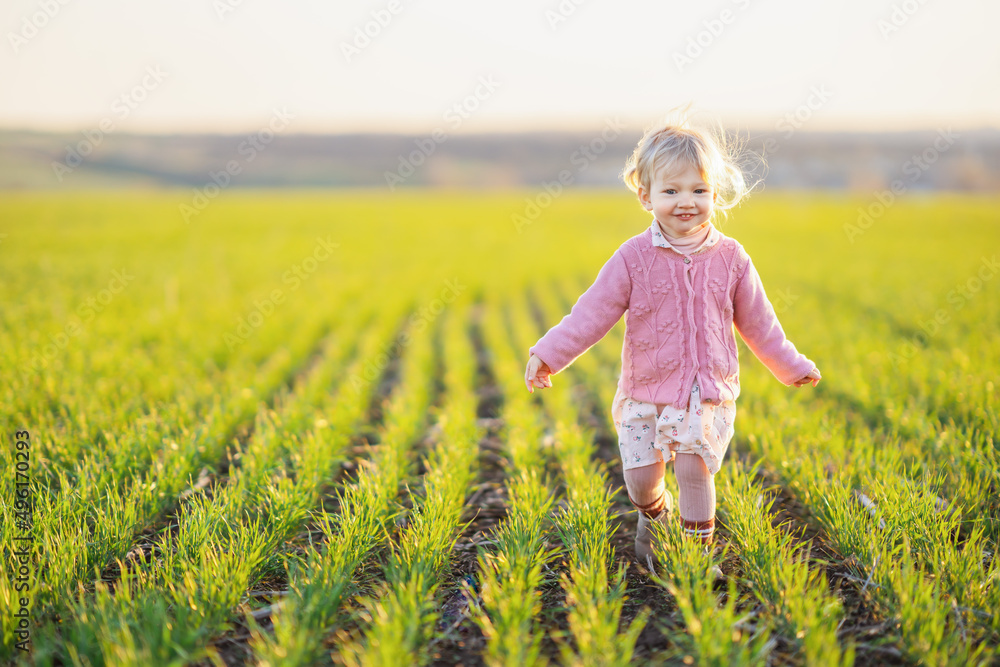 Portrait of cute curly little boy in white shirt, running on sunset meadow. Healthy, breathing, medical, allergy, countryside summer and happy childhood concept. Portrait of cute curly little boy in white shirt, running on sunset meadow. Healthy, breathing, medical, allergy, countryside summer and happy childhood concept.