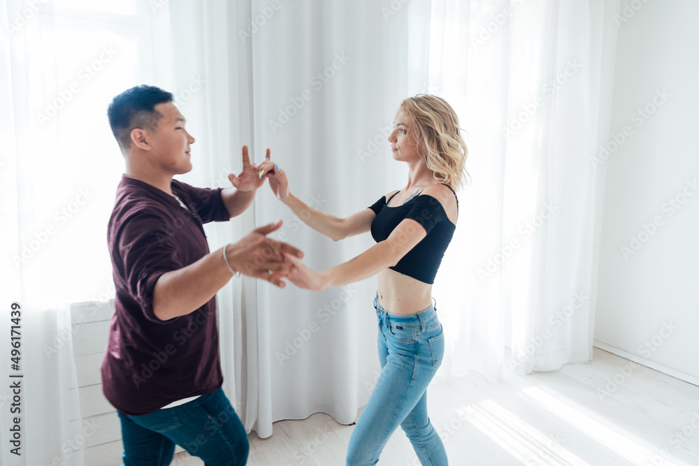 Obraz premium a man and a woman dance together a bachata dance to music