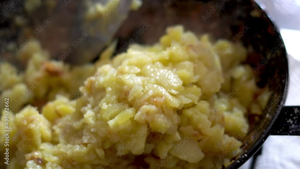 Close up frying potatoes in a pan Close up frying potatoes in a pan
