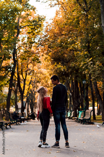  Couple in love walking in the park holding hands