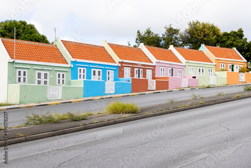 Fototapeta Naklejka Na Ścianę i Meble -  Small colorful houses along the road somewhere in Willemstad, Curacao