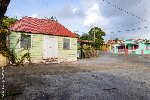 Fototapeta Naklejka Na Ścianę i Meble -  Small house with a light green wooden facade in the suburbs of Willemstad, Curacao