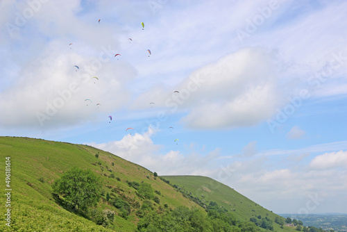 Photography Paragliders flying above the ridge at Pandy, Wales