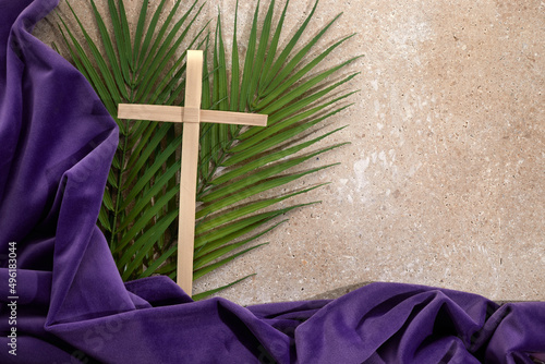 Palm cross and palm leaves. Palm sunday and easter day concept.