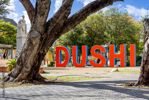 DUSHI written in big red and blue letters in the city center of Willemstad photo