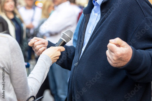 Journalist making media or vox pop interview with unrecognizable person © wellphoto