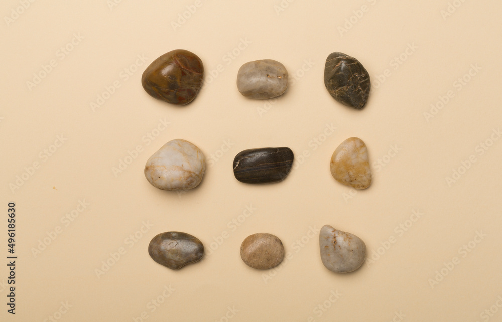 Set of sea stones on color background, top view Set of sea stones on color background, top view