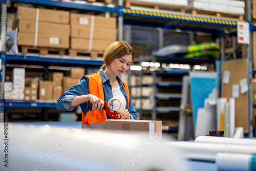 Young woman working in an industrial place of work 