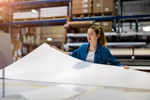Woman working in printing factory
