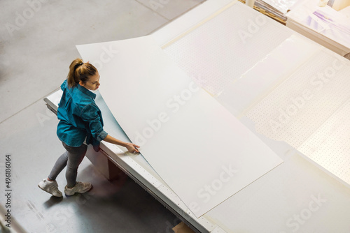 Woman working in printing factory
 photo