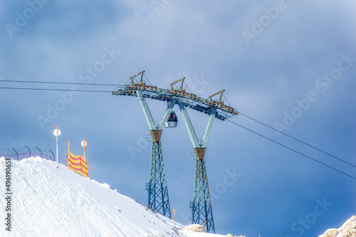 View over ski lift during cold winter day.