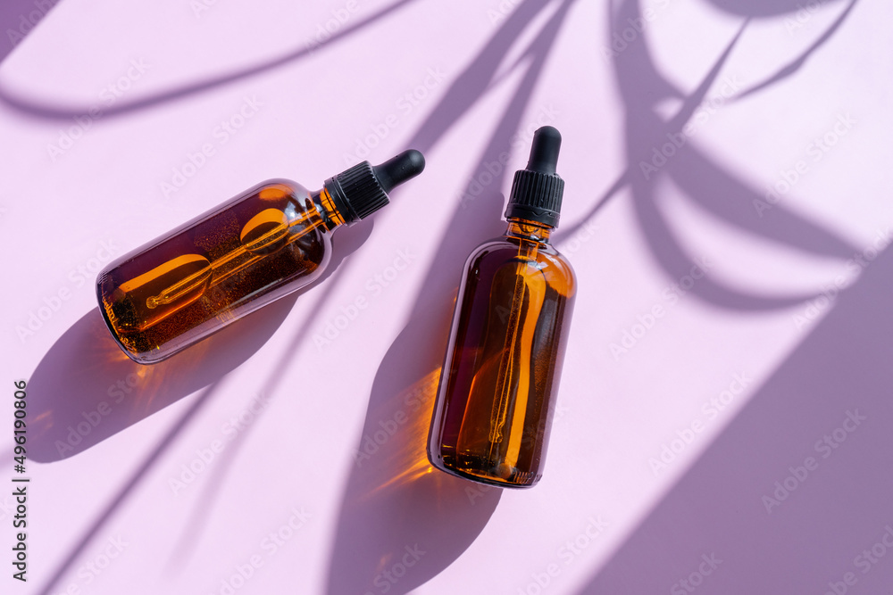 Cosmetics package branding mockup still life amber, dropper, black bottle dispenser, packaging and branding items. Blank, isolated on a powdery pink-lilac background, to place your design.
Cosmetics package branding mockup still life amber, dropper, black bottle dispenser, packaging and branding items. Blank, isolated on a powdery pink-lilac background, to place your design.