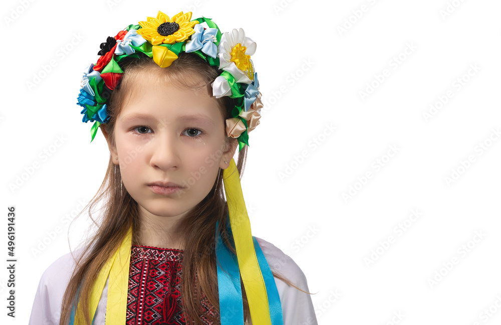Portrait of a little Ukrainian girl with tearful eyes. Child in national dress. Portrait of a little Ukrainian girl with tearful eyes. Child in national dress.