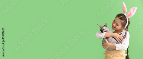 Little girl with bunny ears...