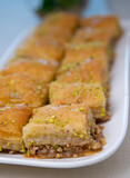Baklawa on a plate on a table, top view, baklava, feast treat ramadan traditional dessert