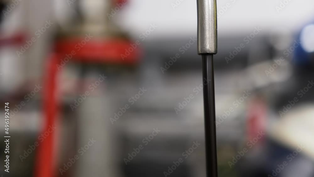 Black liquid flows from the faucet. This is oil flowing from a pipe Black liquid flows from the faucet. This is oil flowing from a pipe